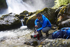 Katadyn Pocket outlet-hose-clip enables quick filling of bottles during trips.
