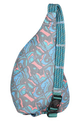 KAVU Rope Sack Topo Smash strap detail highlighting secure elastic keeper for strap stability.