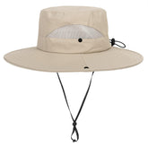 Child wearing dark beige sun hat with wide brim for sun protection outdoors