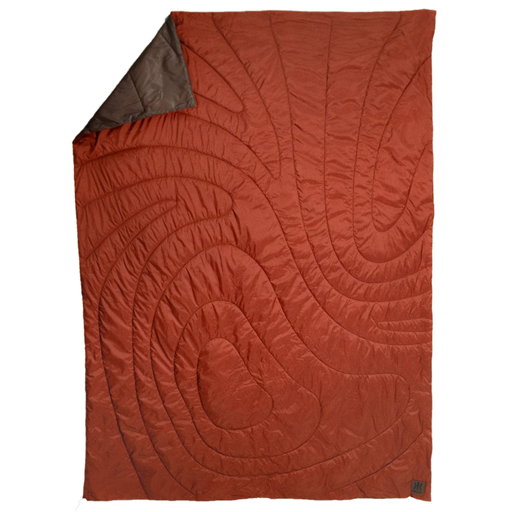 Kijaro Native Camp Quilt in Anza Borrego Orange, top view showing vibrant color and lightweight feel