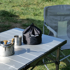 KingCamp camping table rolled up showing quick outdoor setup.