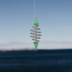 Carp fishing equipment setup with bait holder and feeder