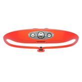 KNOG Bandicoot 250 headlamp on head in coral for hands-free outdoor lighting