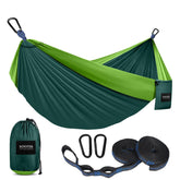 Kootek camping hammock setup with tree straps for quick, comfortable outdoor relaxation.