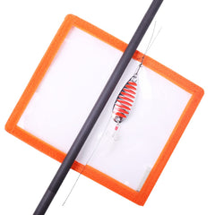 Close-up of clear puncture-resistant PVC window on orange lure wrap