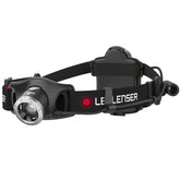 Ledlenser H7R.2 headlamp worn on the head for hands-free bright visibility.