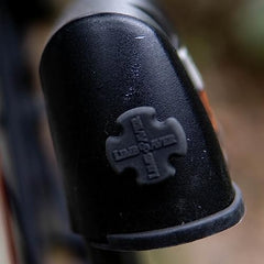 Low-profile Mini UltraQuad dampeners installed on archery accessory