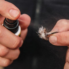 Loon Outdoors Fly Spritz 2 application demonstrating fast-drying action on flies.