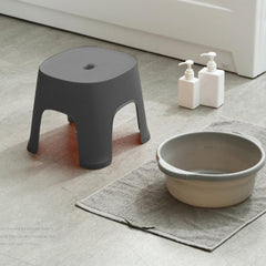 Lovskoo Plastic Mini Stool at entryway, easy shoe changing assistance.