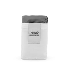 Matador Pocket Blanket 4.0 folded compactly for palm-size portability.