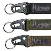 Maxpedition Keyper closeup in black showing compact retention and quick belt access