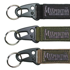 Maxpedition Keyper closeup in black showing compact retention and quick belt access