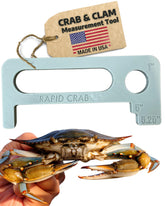 Floating Maryland crab measuring tool on water