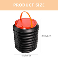 Mikikit camping water bucket setup beside gear and tent.