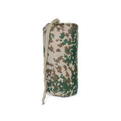 Mil-Tec Ripstop Poncho Liner functioning as a ground mat to stay dry.