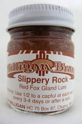 Milligan's Slippery Rock Red Fox Gland Lure 1oz bottle showing thick formula for all-season attraction.
