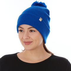 Minus33 Merino midweight pom beanie royal blue side view for versatile wear.