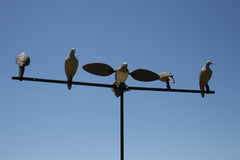 MOJO Outdoors dove decoy perched on a branch showcases secure clip-on setup.