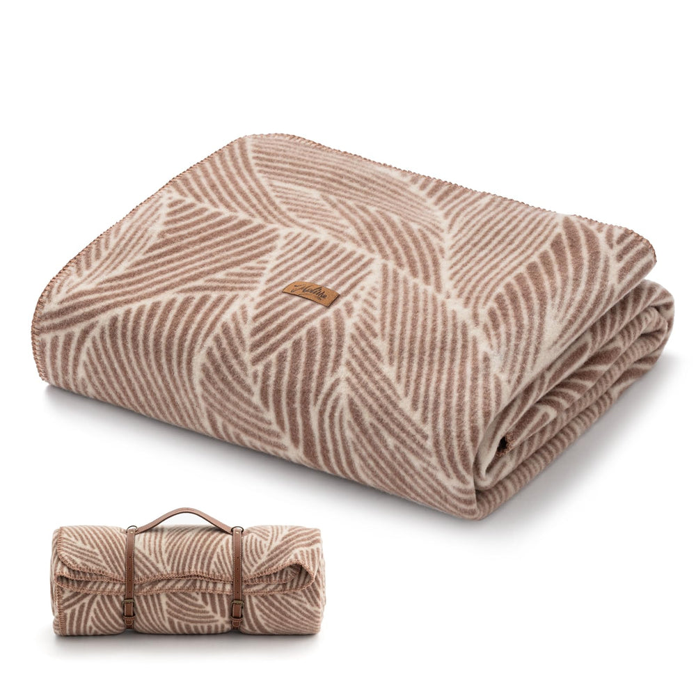 Molithe wool blanket folded, 62x86, showcasing versatile indoor and outdoor warmth