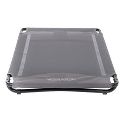 Momarsh low-profile dog cot inside kennel shows compact comfort and crate-ready fit.