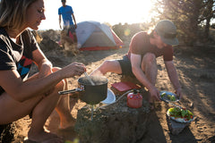 MSR Alpine Long Camping Tool Spoon pictured with stand-up pouch meals for camp cooking.