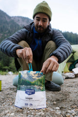 MSR folding camping spork closed inside mug for compact packing.