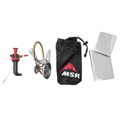 MSR WhisperLite International self-cleaning shaker jet in action for field maintenance.