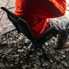 Muddy Swivel Ground Seat with removable carry strap for on-the-go transport.