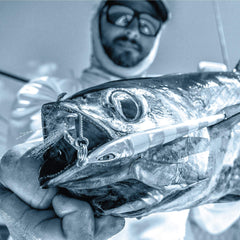 Mustad Moon Riser Jig Yellow Candy 150g action shot demonstrates long slow strokes for extended jig sessions.