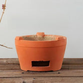 Mwpqbd Chaozhou red clay stove close-up, showcasing rustic craftsmanship and durable texture for outdoor tea.