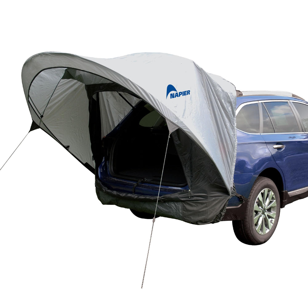 Napier Sportz Cove hatch shade extending over the hatch for sun protection during camping.