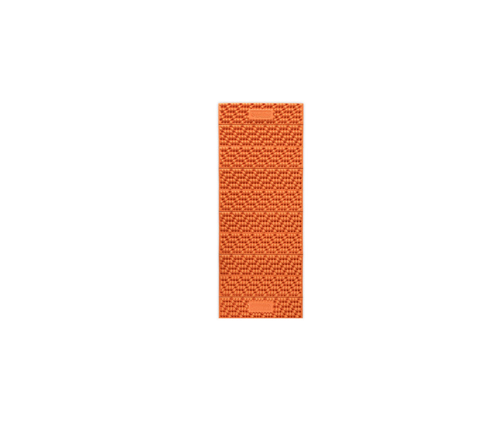 NEMO Switchback foam sleeping pad Short in Sunset Orange on a rugged campsite, highlighting plush comfort