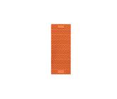 NEMO Switchback foam sleeping pad Short in Sunset Orange on a rugged campsite, highlighting plush comfort