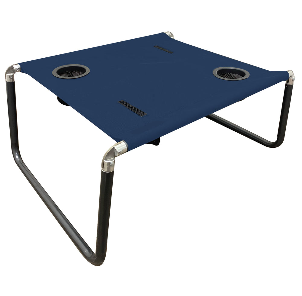 Neso Beach Table with level surface on sand for stable outdoor setups.