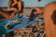 Neso Beach Table phone pockets provide quick access during outdoor use