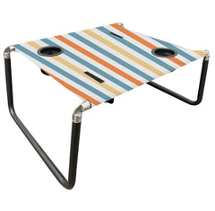 Neso Beach Table stable-surface on sand supports outdoor meals and drinks.