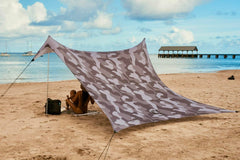 Neso Grande beach tent setup shows quick two-pole assembly for effortless day planning.