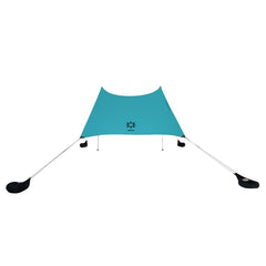 Neso Grande sun shelter setup shows easy assembly and wide shade coverage for family beach days.