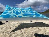 Neso portable beach tent sand anchor secures shade on windy shores.