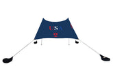 Neso portable beach tent setup provides instant shade for family outings.