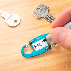 Nite Ize IdentiKey SlideLock close-up of waterproof write-on tab for durable key labels