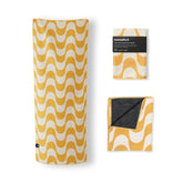 Nomadix Mini Towel Copacabana Mango packaged for travel; space-saving and eco-friendly.