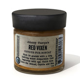 North American Trapper RED Vixen Johnny Thorpe lure bottle pour for precise outdoor applications.