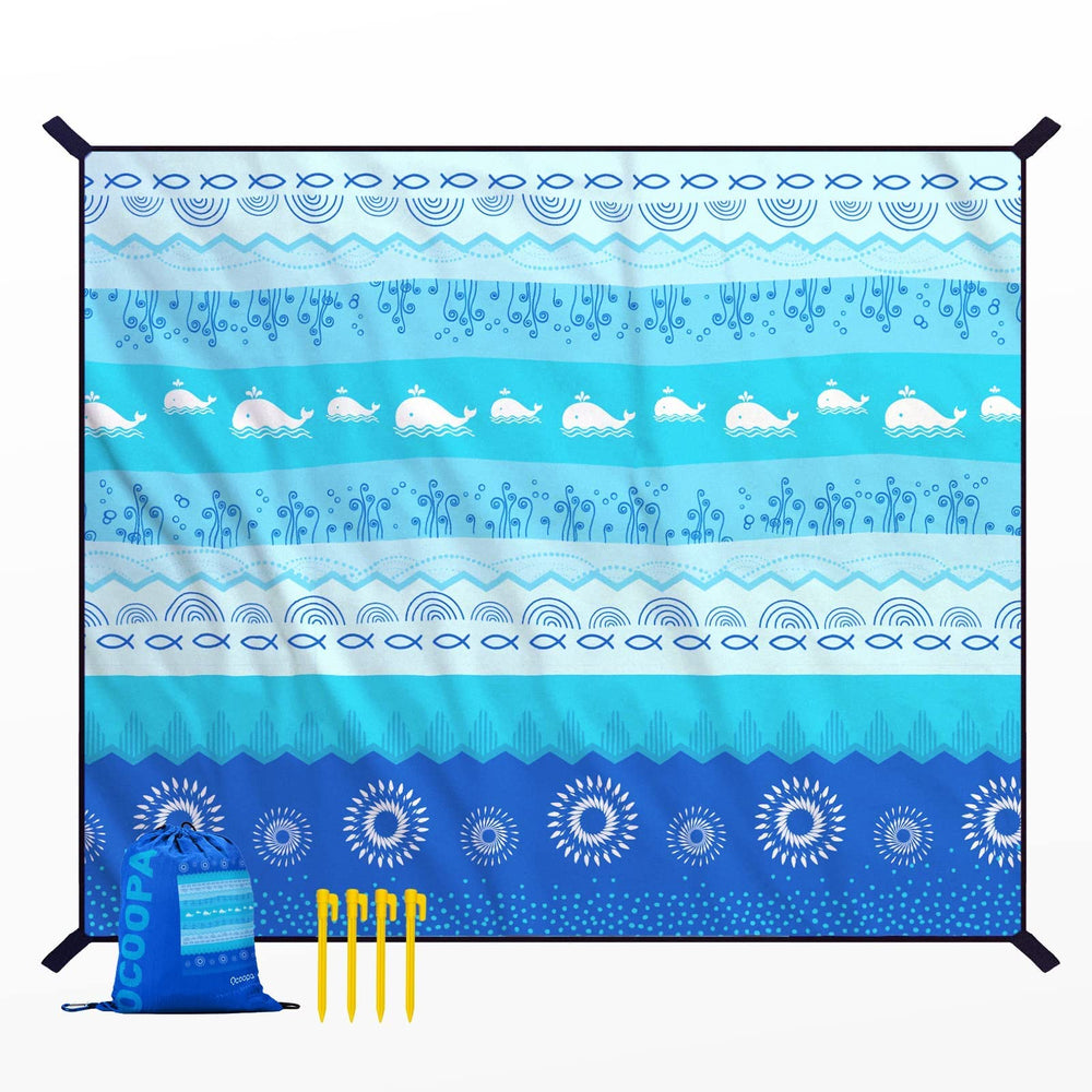 OCOOPA beach blanket 10x9 size offers roomy comfort for family beach days.