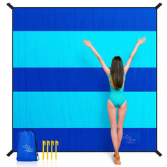 OCOOPA extra-large beach blanket with wide stripe pattern for quick beach setup.