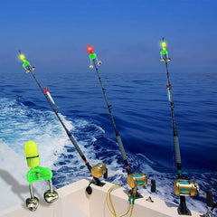Green LED bite alarms lit on fishing rod
