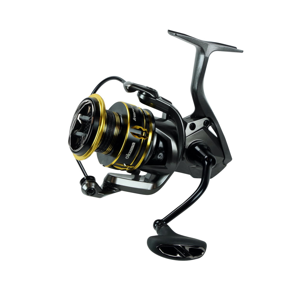 OKUMA Inspira ISX reel close-up shows TCA frame for torsion-resistant performance during long casts.