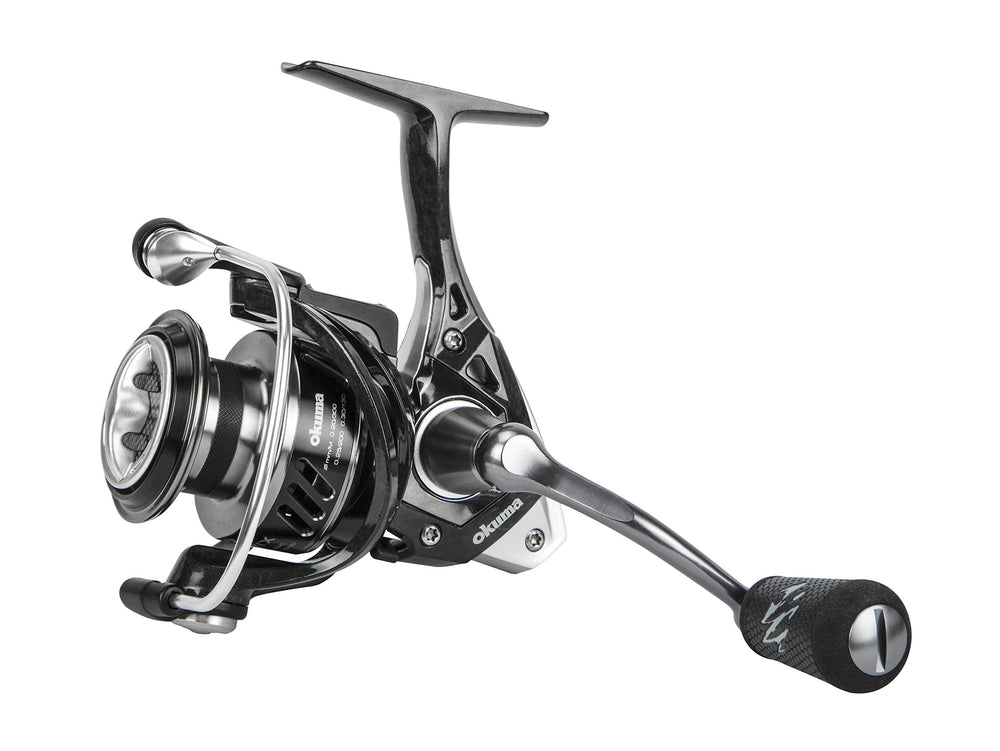 OKUMA ITX-1000H spinning reel side view shows rugged construction for demanding fishing.