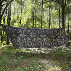 Onewind camo tarp hammock area shows versatile shelter for hammock setups