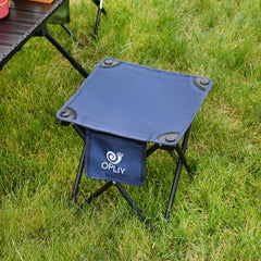 Opliy camping stool blue in-use at the beach provides sturdy seating.